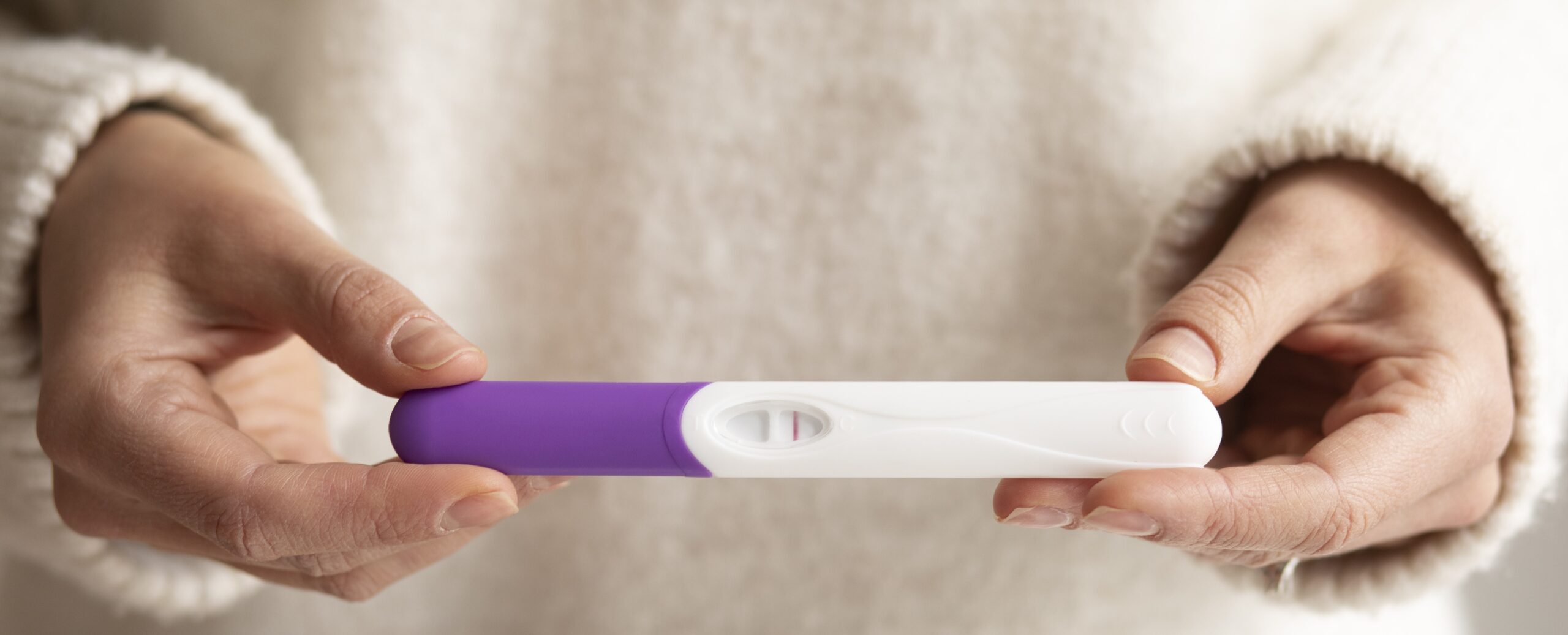 close-up-hands-holding-pregnancy-test